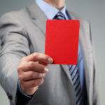 Showing the red card concept for bad business practice, exclusion or criminal activity